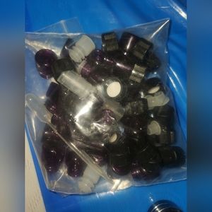 Tiny glass purple bottles